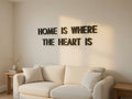 Modern minimal 3D printed letters spelling a quote on a living room wall