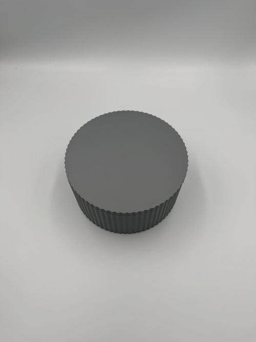 Grey fluted cylinder storage box with elegant vertical ribbed texture