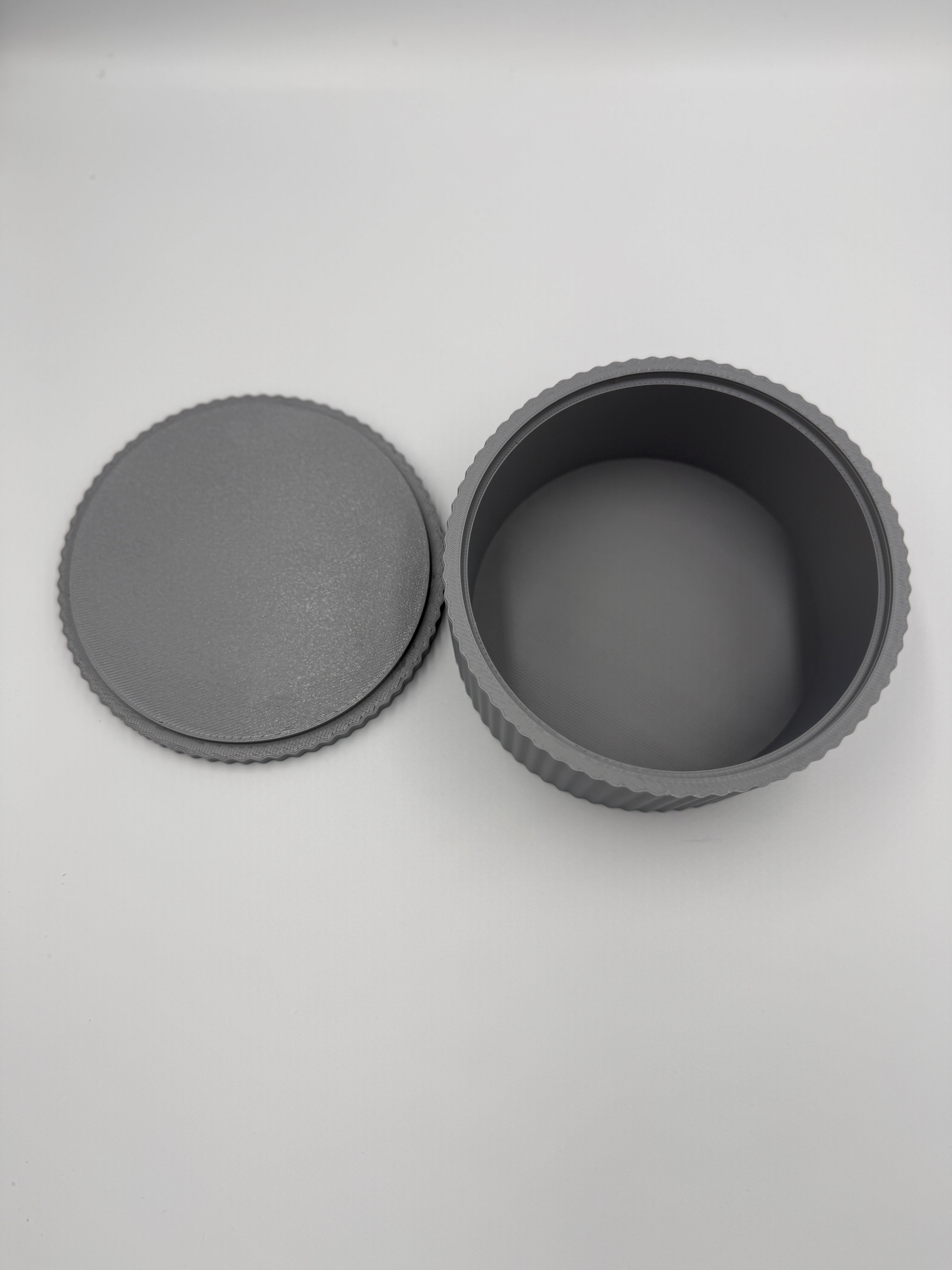 Close-up of the vertical flute detail on the grey storage box