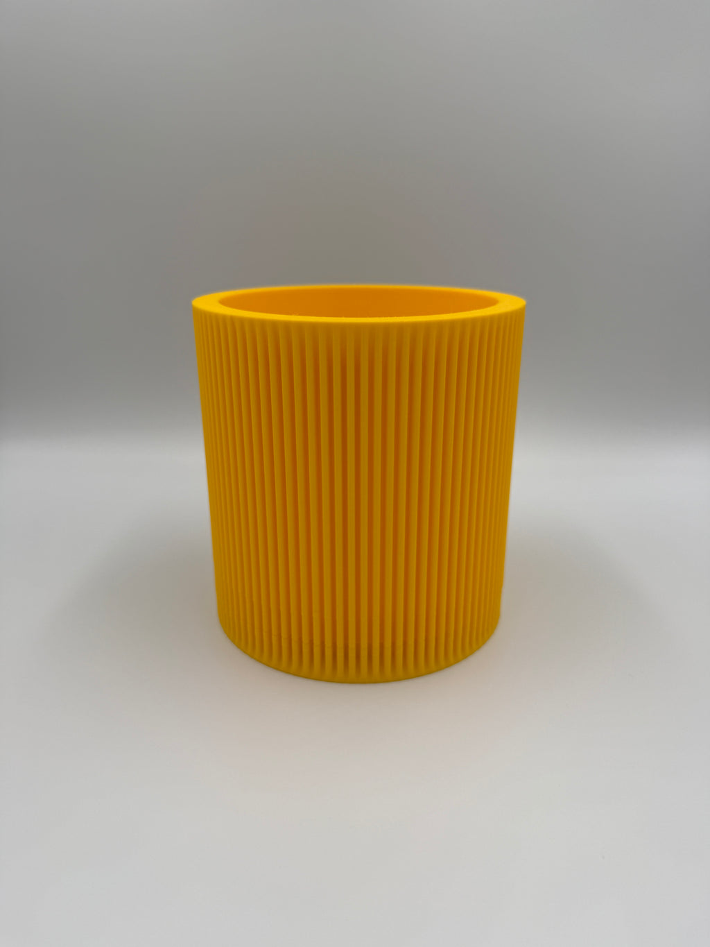 Round fluted 3D printed wall planter, product photo showing fluted texture