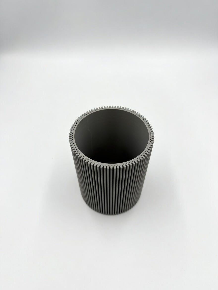 Round fluted pencil holder with 90 vertical ribs styled on a modern desk