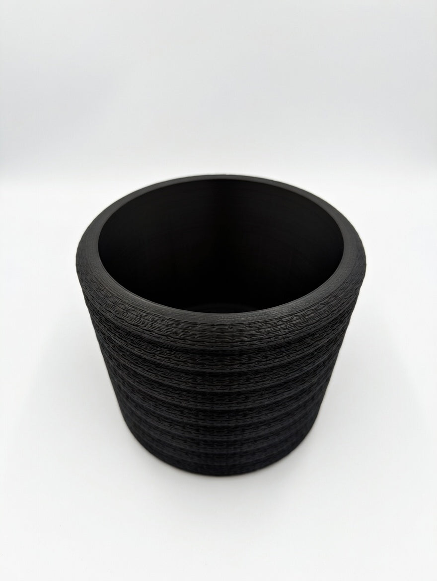 Knit Stack desk planter with chunky knit texture on a home office desk