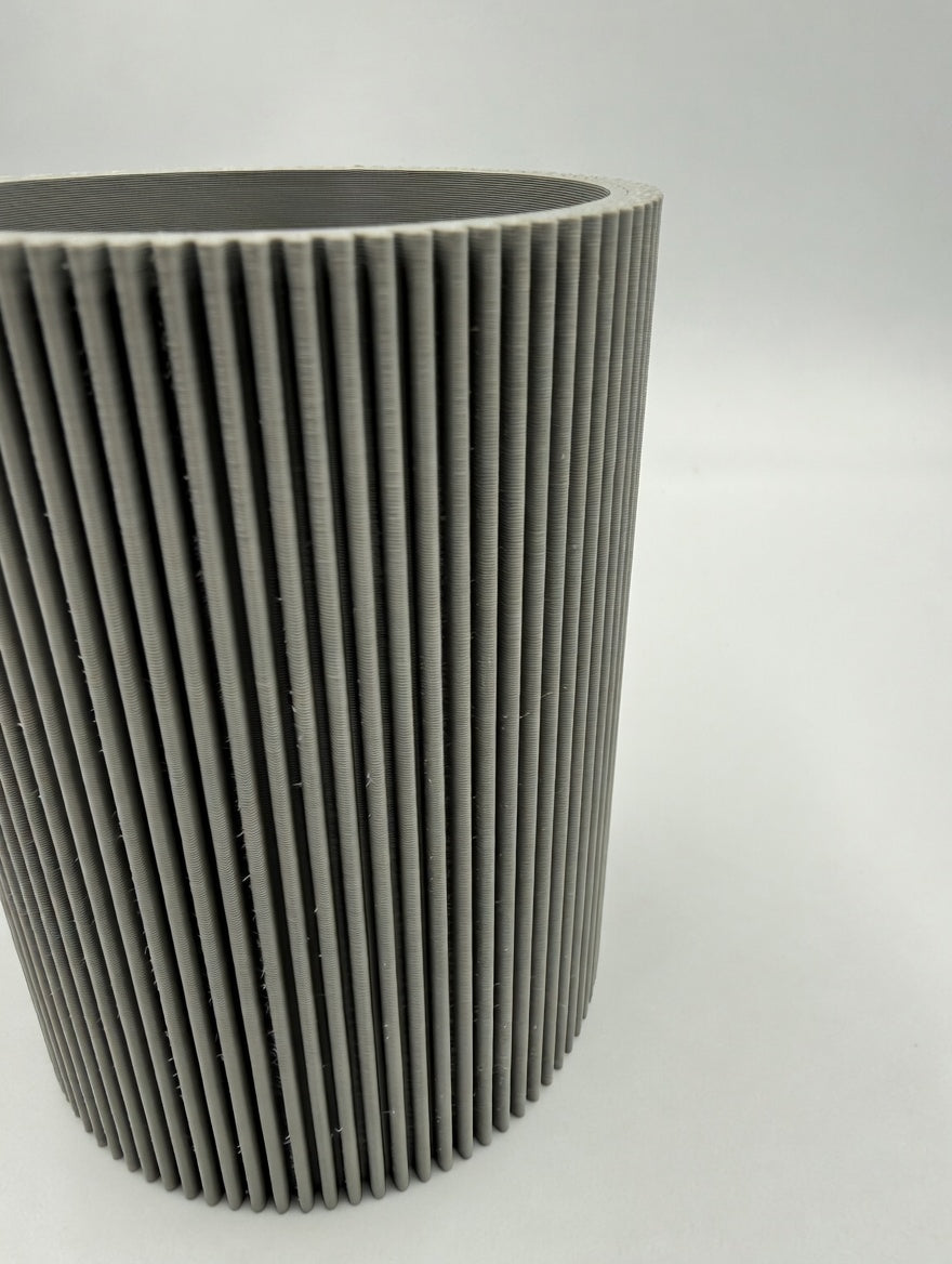 Close-up of the fine ribbed fluted texture and shadow lines