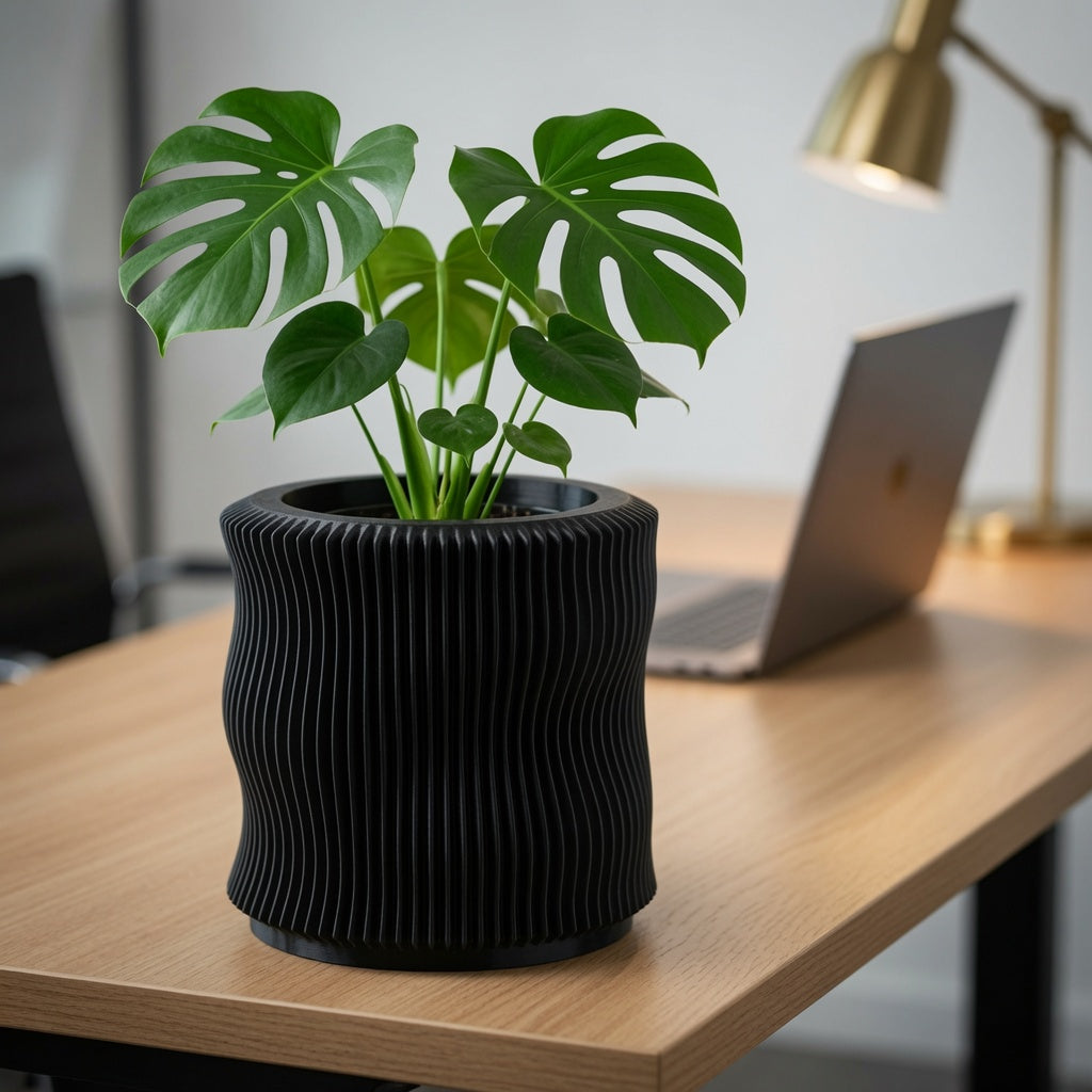 Hidden twist-lock drip tray tucked under the Soft Organic fluted planter