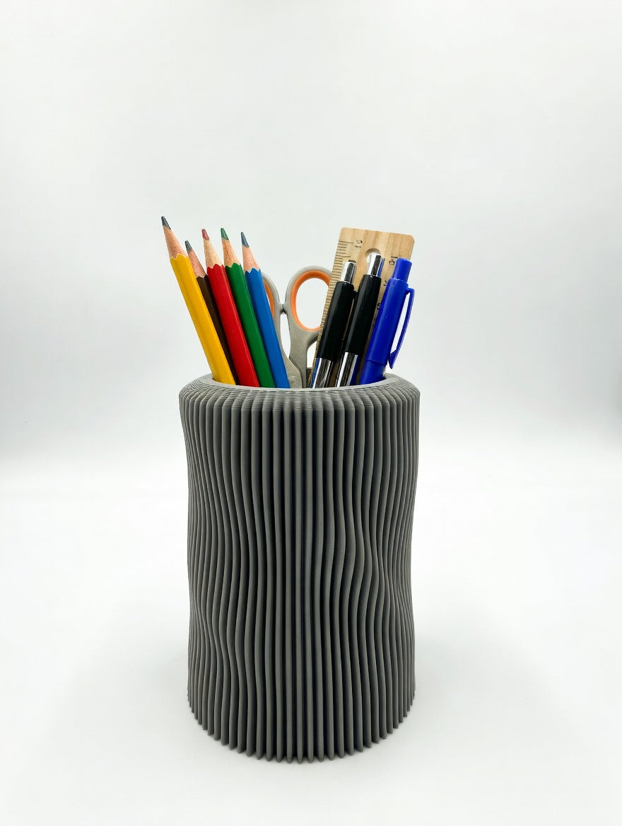 Soft organic pencil holder used as a sculptural desk vase