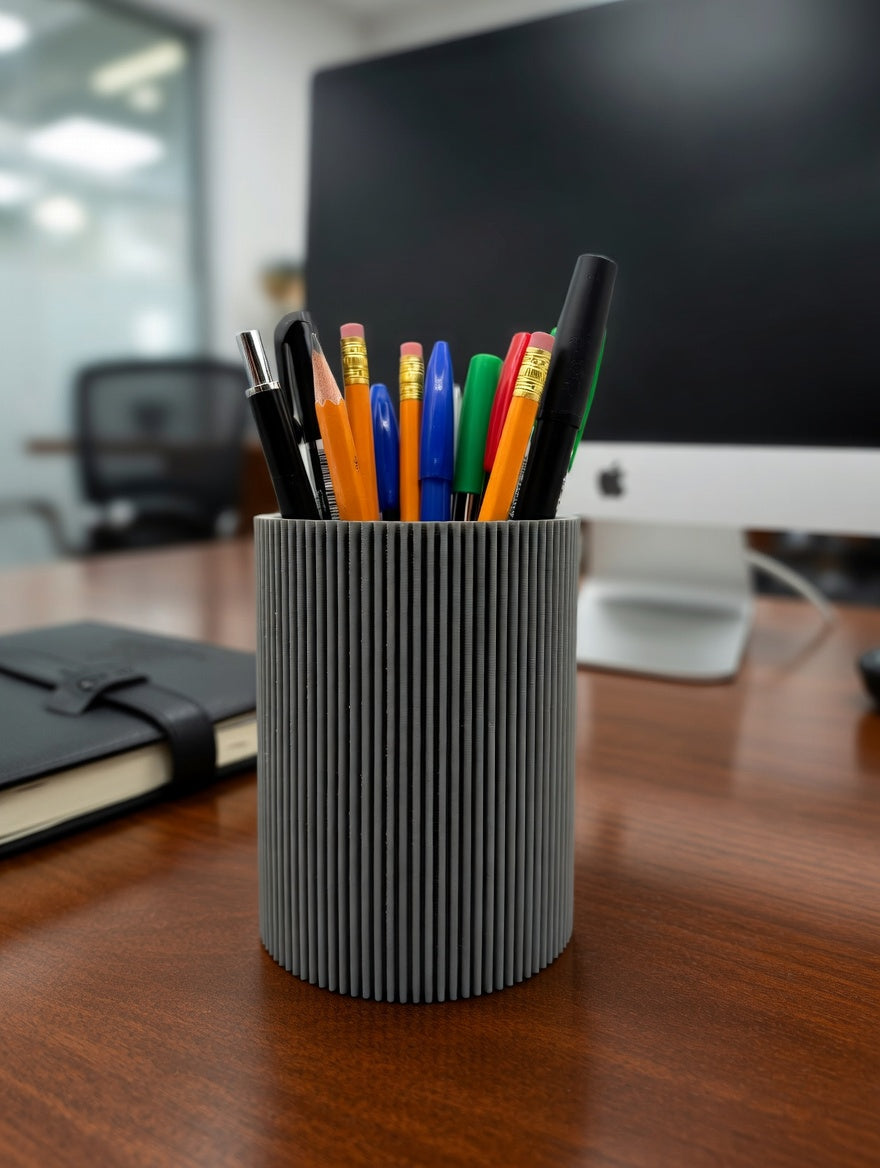 Round fluted pencil holder displayed on a shelf as a decorative accent