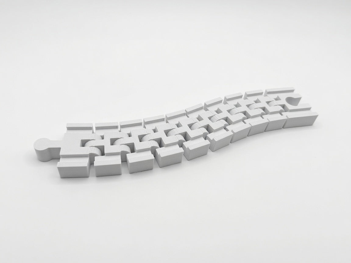Flexible track segments articulating on their built-in hinges