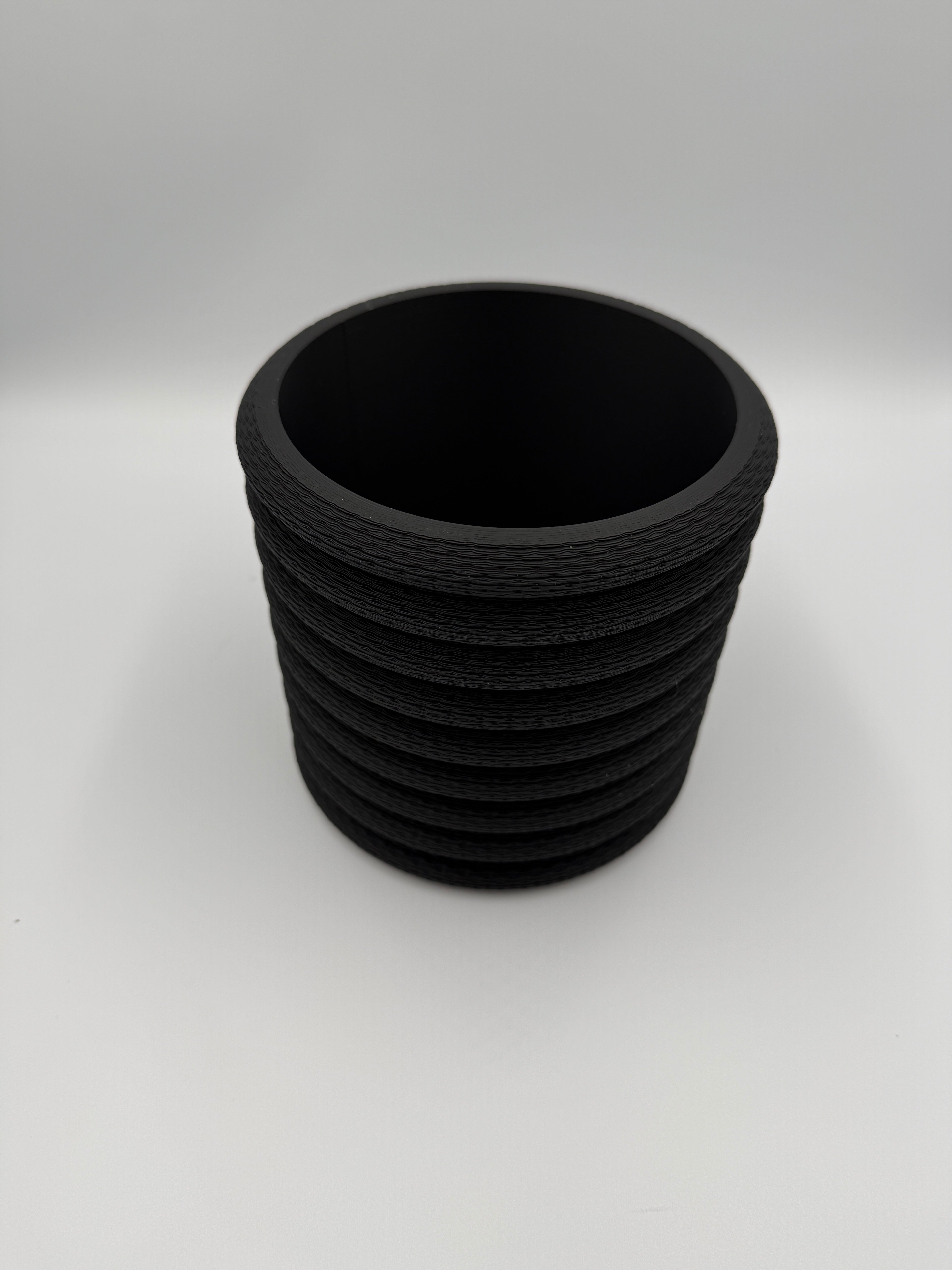 Black Knit Stack wall planter, angled three-quarter view showing knit texture