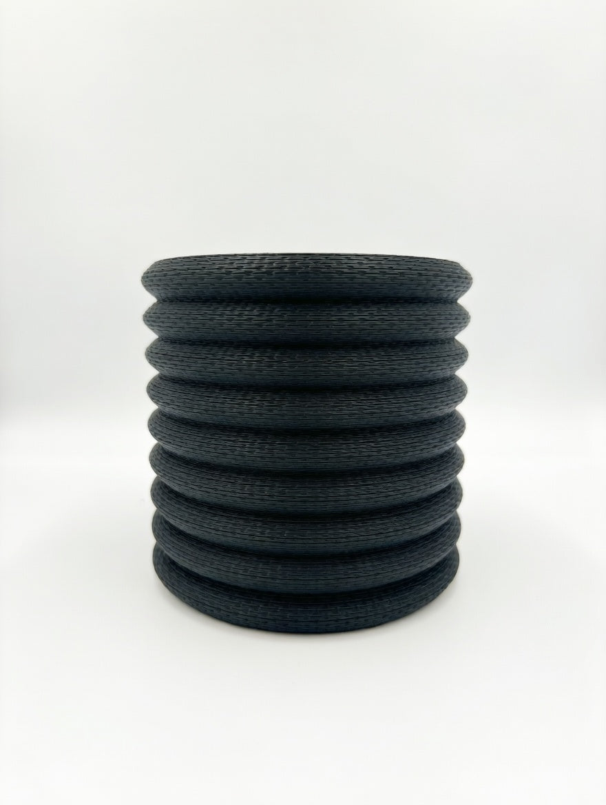 Dark charcoal Knit Stack wall planter, studio product shot