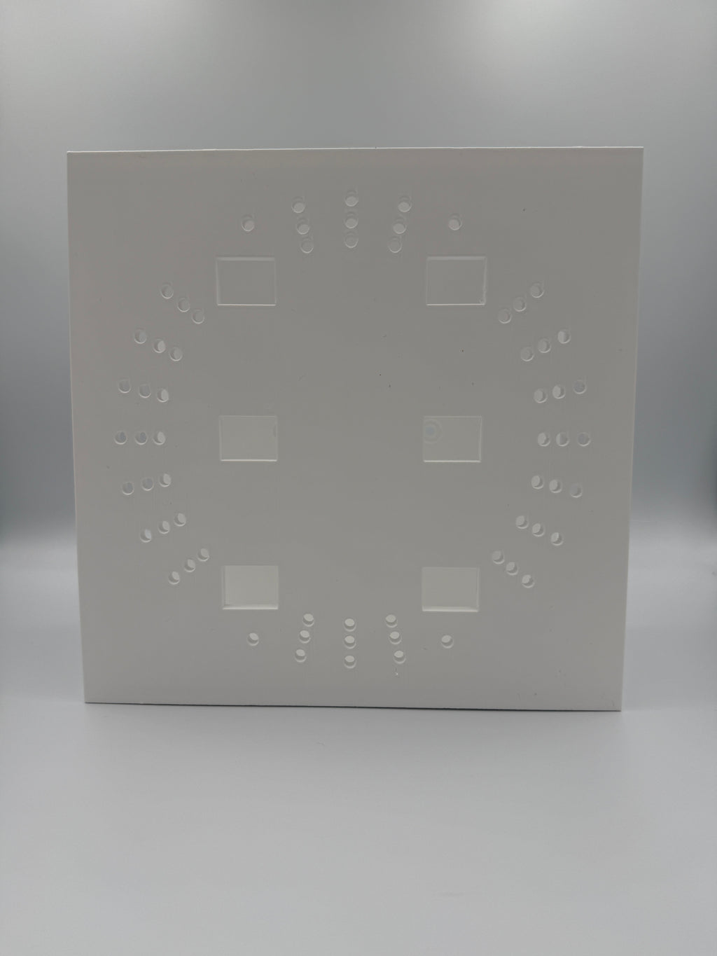 Base of the mount showing full ventilation pattern and screwdriver access slots