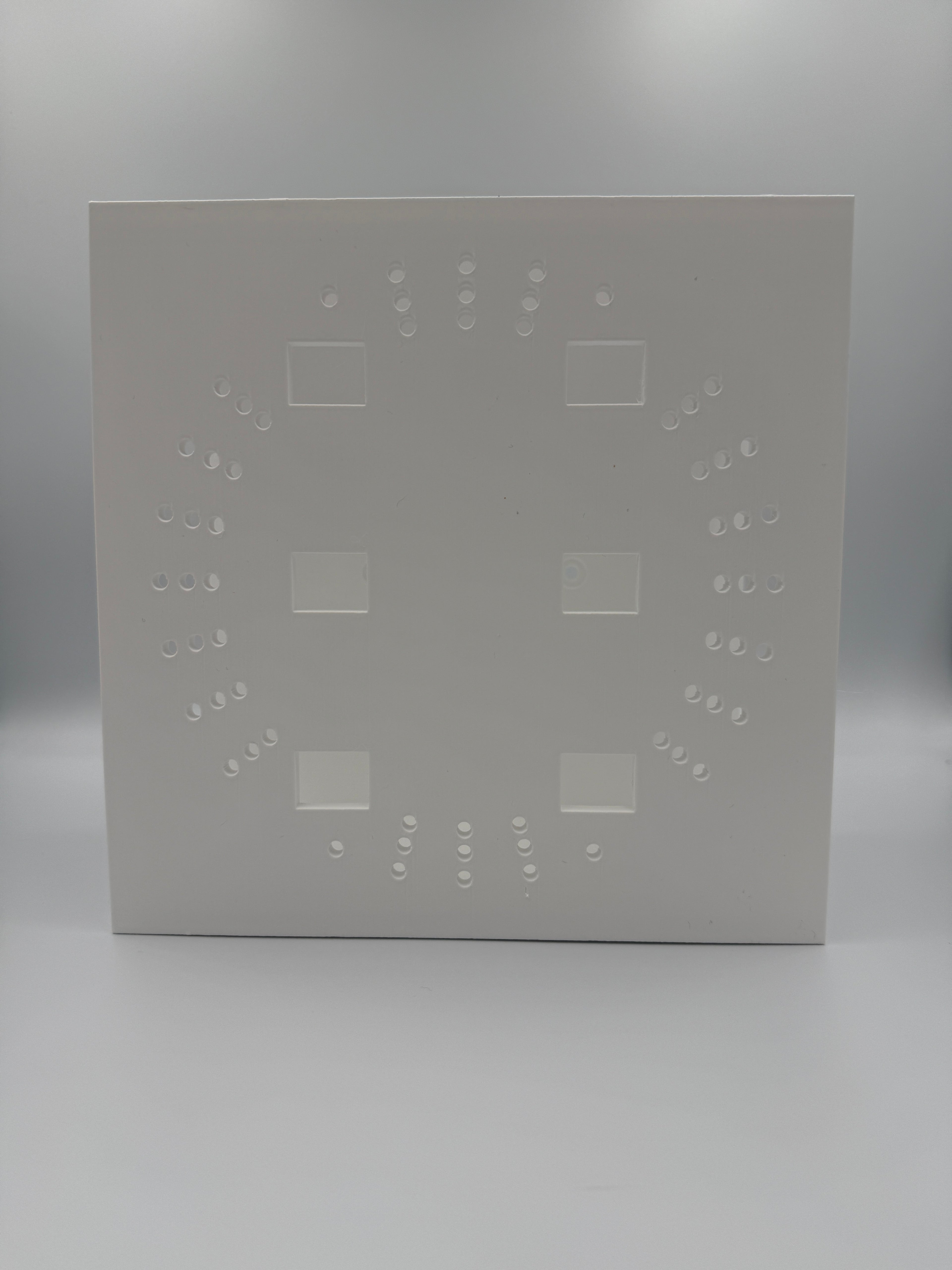 Base of the mount showing full ventilation pattern and screwdriver access slots