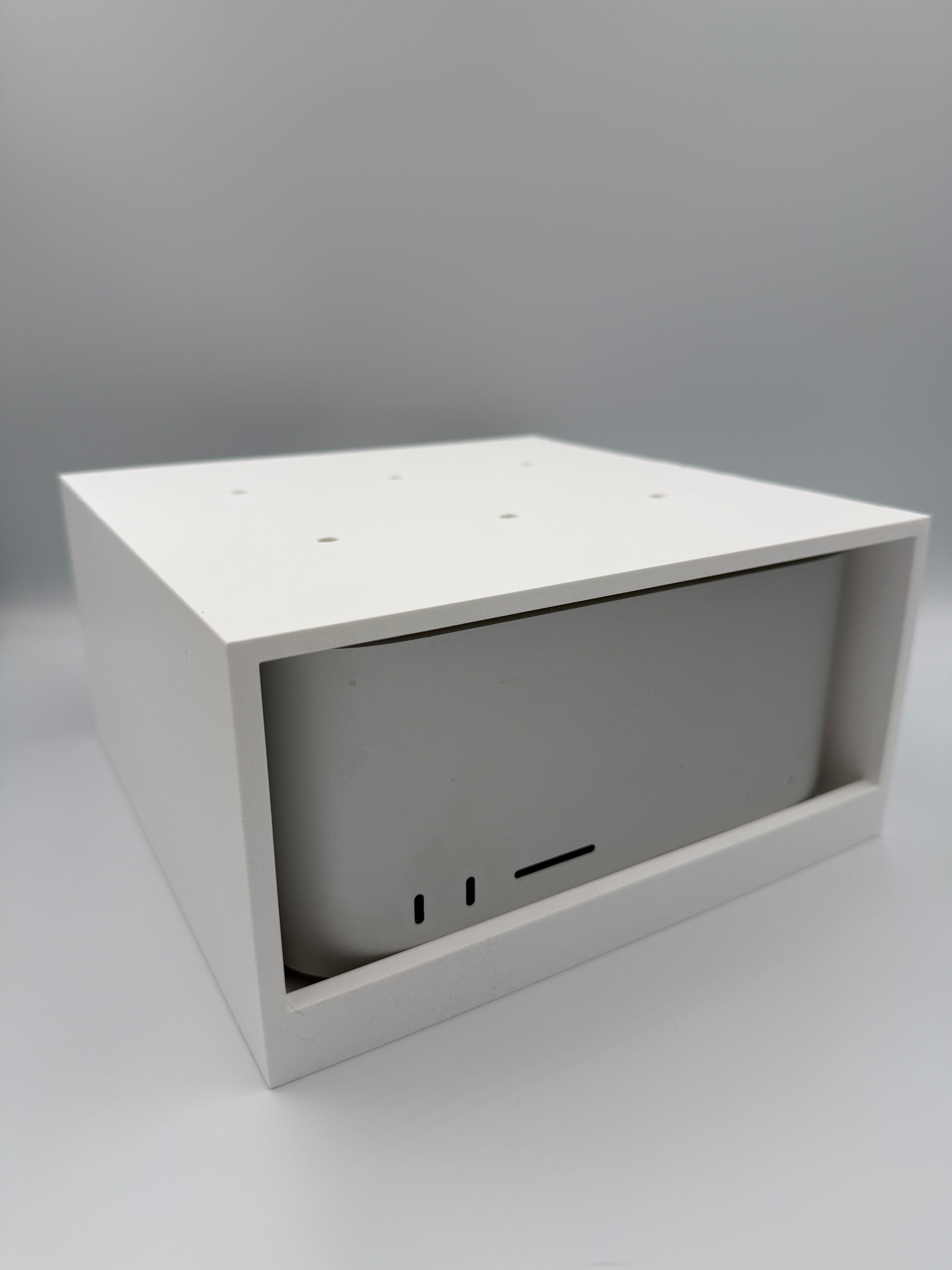 Mac Studio mounted in the under-desk cage with cables routed through the open back