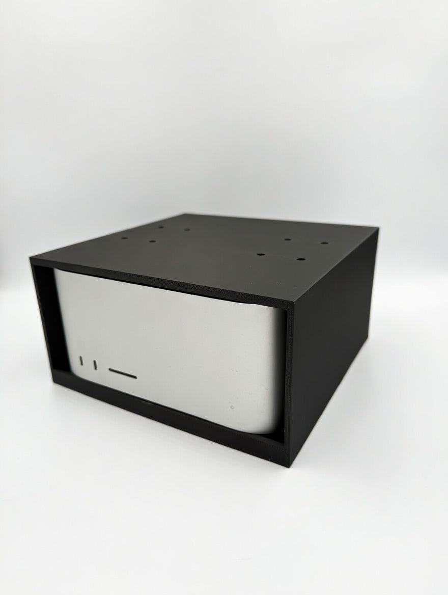 Front angle view of the cage mount with Mac Studio inserted