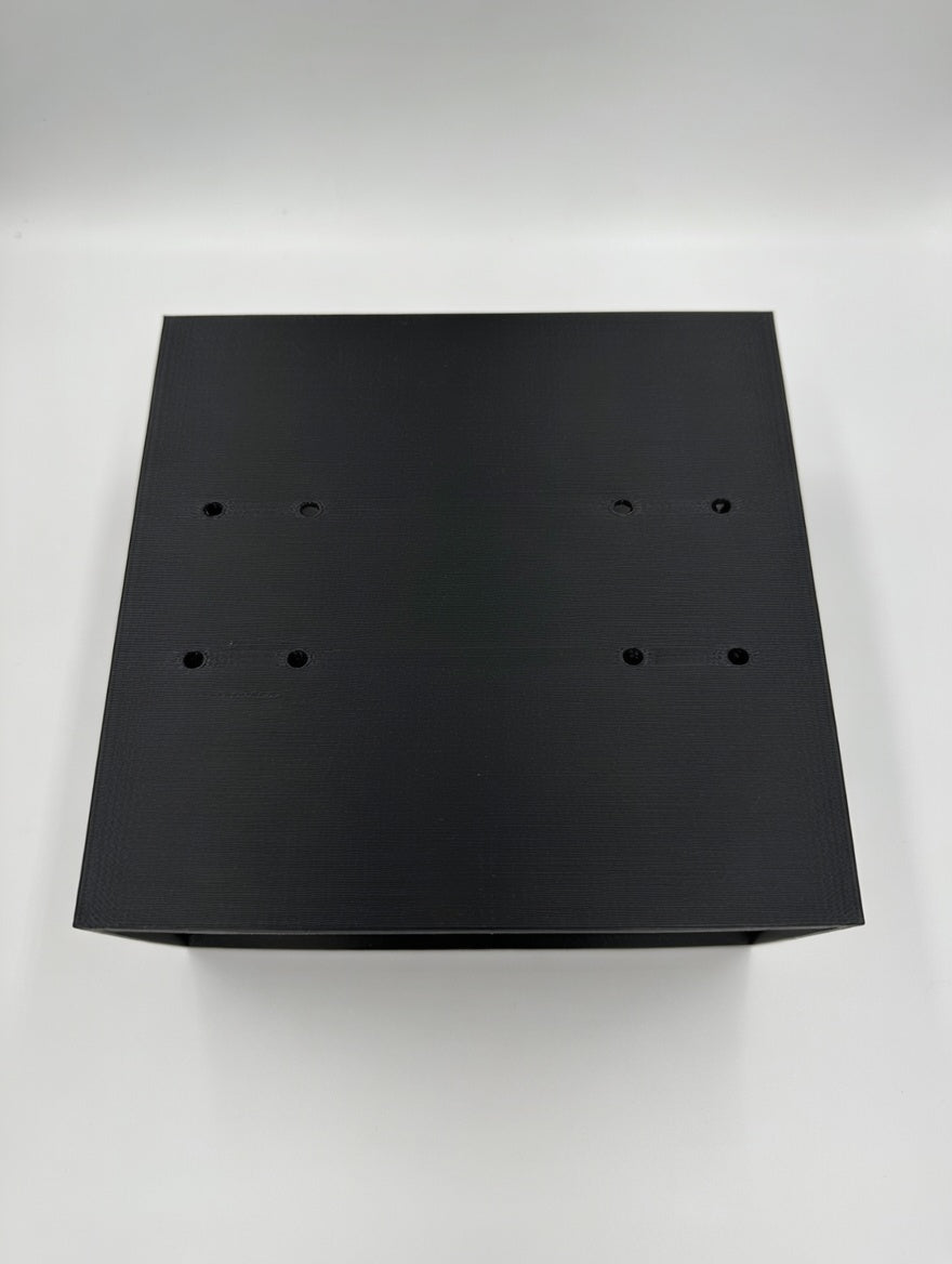 Top of the cage mount showing the pre-drilled M5 screw holes