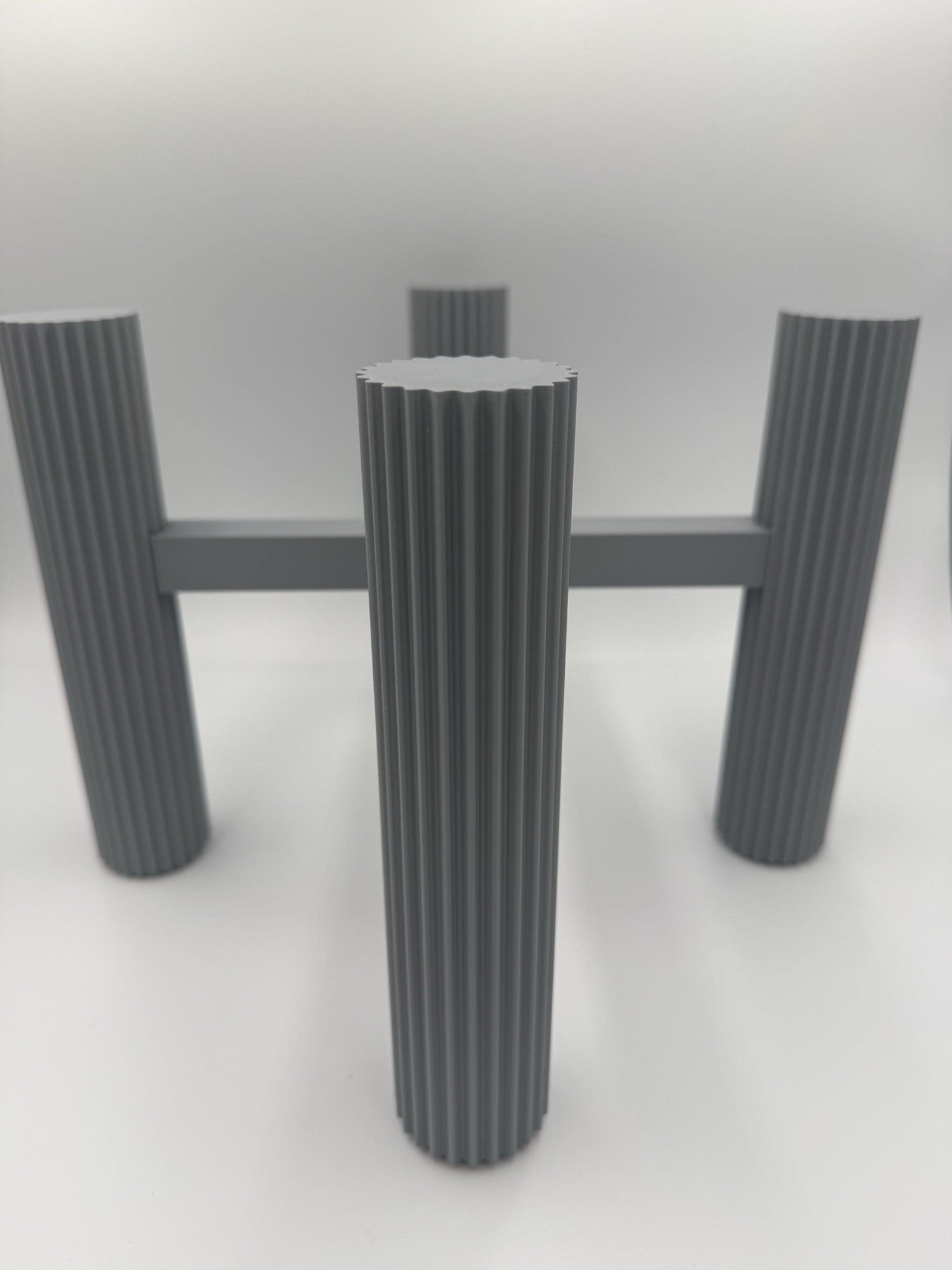 Close-up of the fluted column leg with 24 vertical channels
