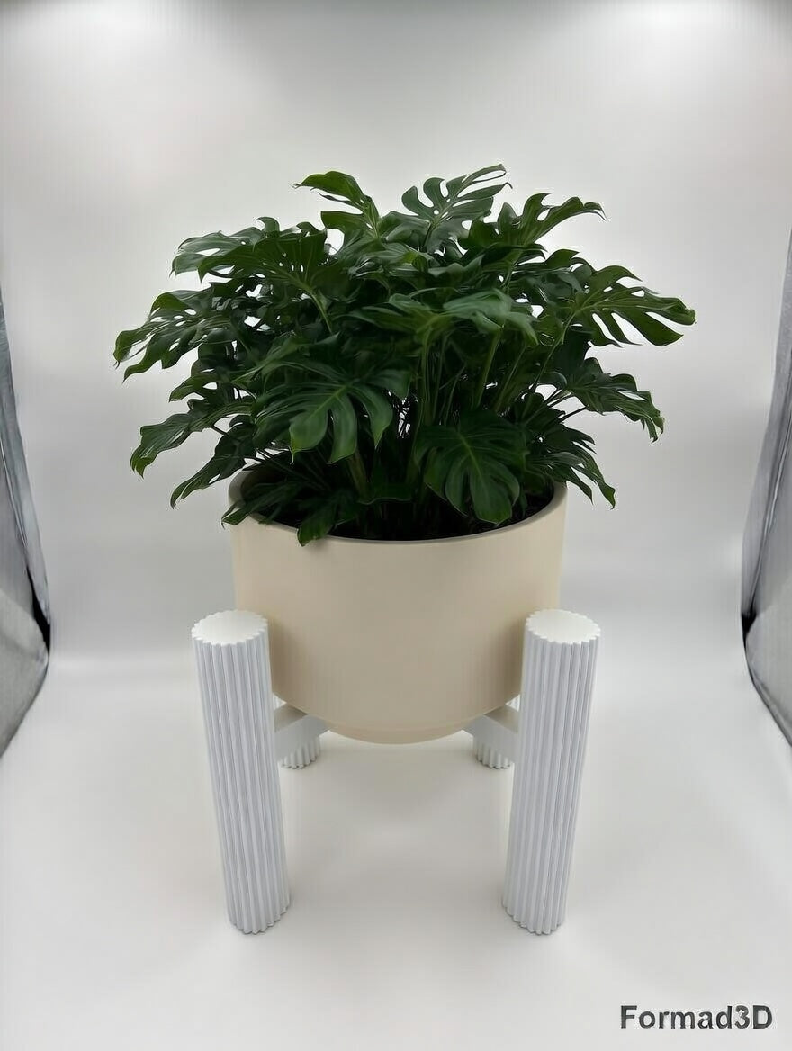 White round fluted elevated stand with monstera, front view
