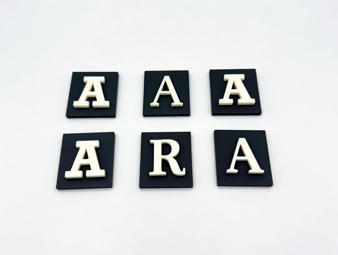 White letter A on navy base in six different fonts, flat lay