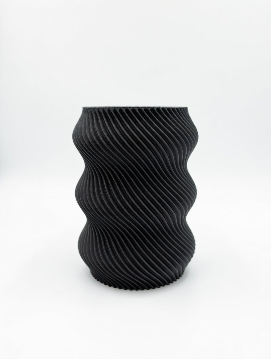 Black wavy twisted pencil holder studio shot on white background